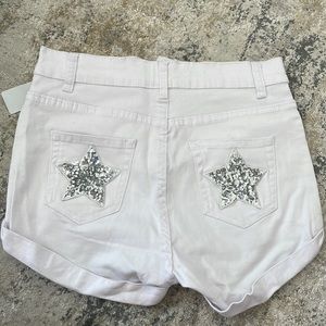 White jean shorts with star pockets